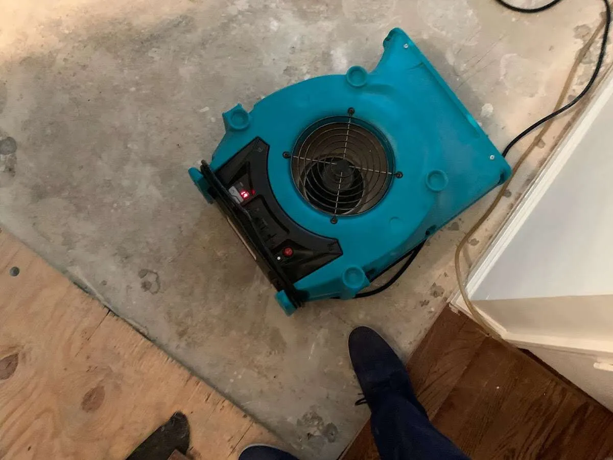 Air mover drying subfloor during Leak Detection & Repair in Chicago Heights